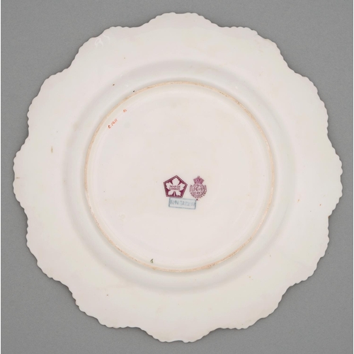 546 - A Royal Worcester plate, c1917, painted by Roberts, signed, with two or three pink and yellow roses ... 