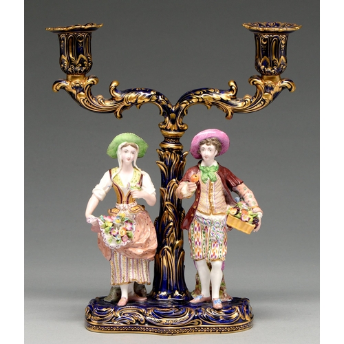 550 - A Minton candelabrum, c1830, of two richly gilt cobalt sconces on scrolling branches and a palm tree... 