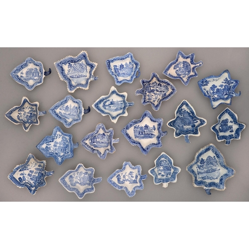 556 - Nineteen English blue printed pearlware and earthenware leaf shaped pickle dishes, early 19th c, lar... 