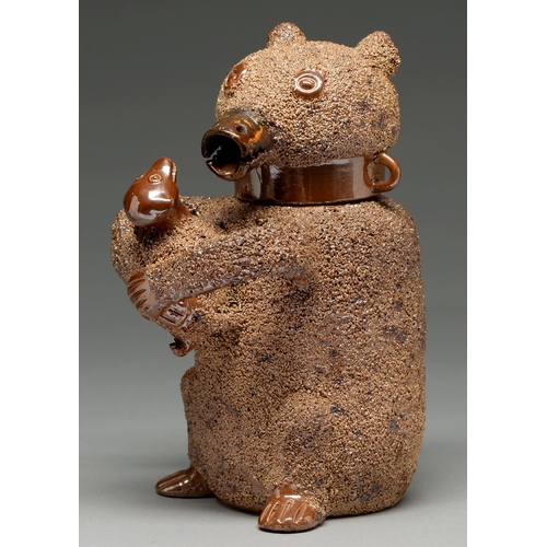 563 - A Nottingham saltglazed brown stoneware bear jug, third quarter 18th c, the bear and the dog coated ... 