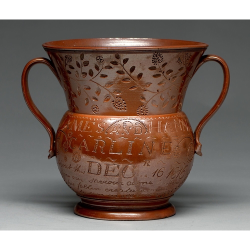 565 - A Derbyshire saltglazed brown stoneware loving cup, Chesterfield, dated 1816, incised JAMES AND HANN... 