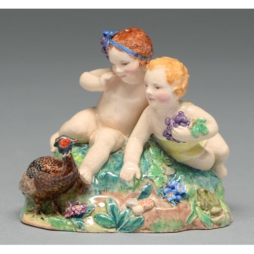 578 - J S Bray and V Williams. A Dulwich Pottery group of two children and a pheasant, 1934, 75mm h, paint... 