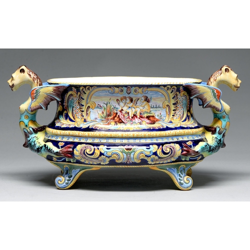 607 - A French faience cistern, 20th c, with winged and fish tailed grotesque handles, the oval bowl paint... 