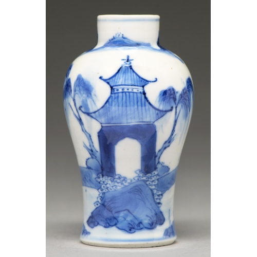 74 - A Chinese blue and white miniature baluster vase, 19th c, painted with figures on bridges between te... 