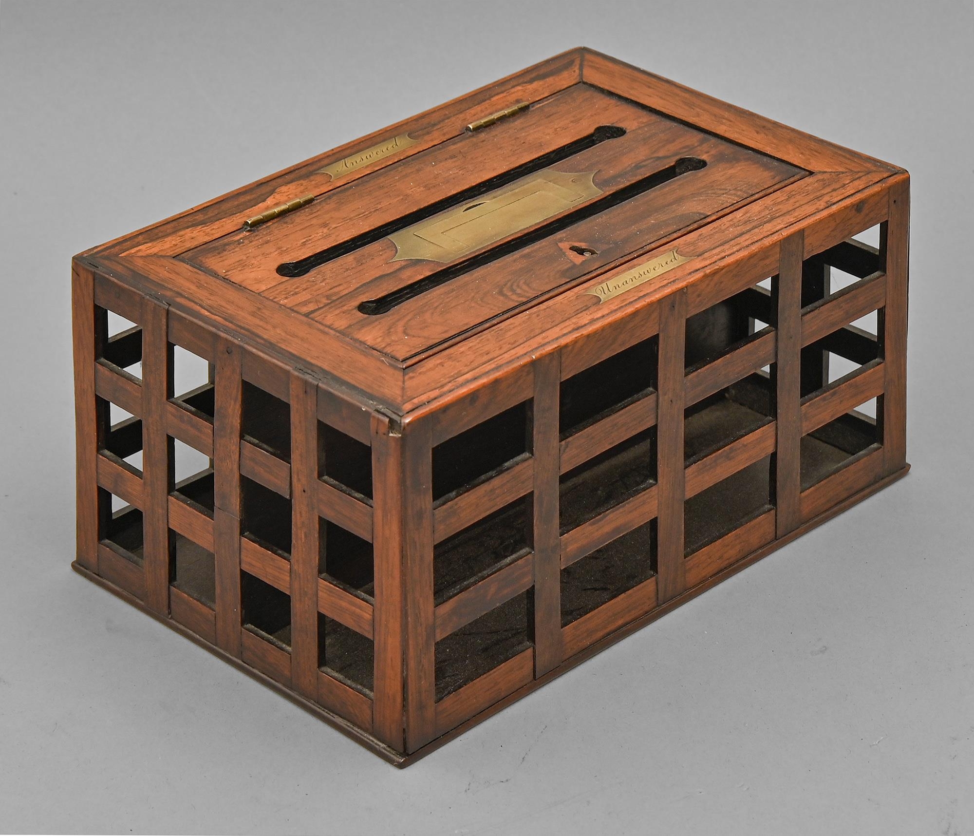 A Regency rosewood letters box, with trellis sides and twin slot lid