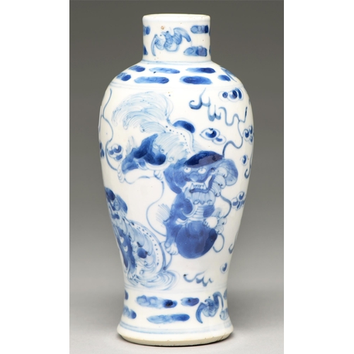 86 - A Chinese blue and white baluster vase, 19th / early 20th c, painted with dogs of Fo, 19cm h, Kangxi... 