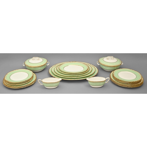 909 - A Crown Staffordshire bone china apple green and gilt bordered dinner service, printed mark... 