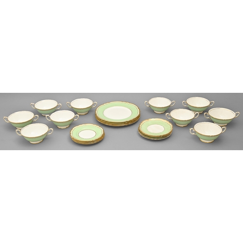 909 - A Crown Staffordshire bone china apple green and gilt bordered dinner service, printed mark... 