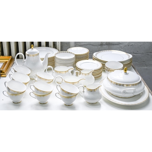 910 - A Royal Doulton bone china Gold Lace pattern dinner service, printed mark