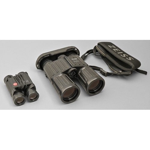 914 - Binoculars. Two, Leica 8x20BCA, in zipped pouch and Zeiss 10x40B, rubberised, zipped black leather p... 