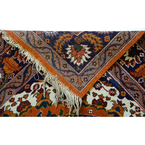 916 - An Indian rug, 126 x 199cm