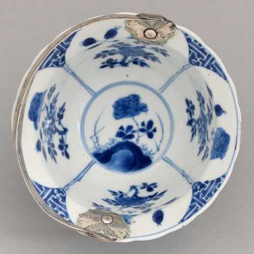 96 - A Chinese blue and white bowl, Kangxi period, painted with auspicious objects alternating with flowe... 