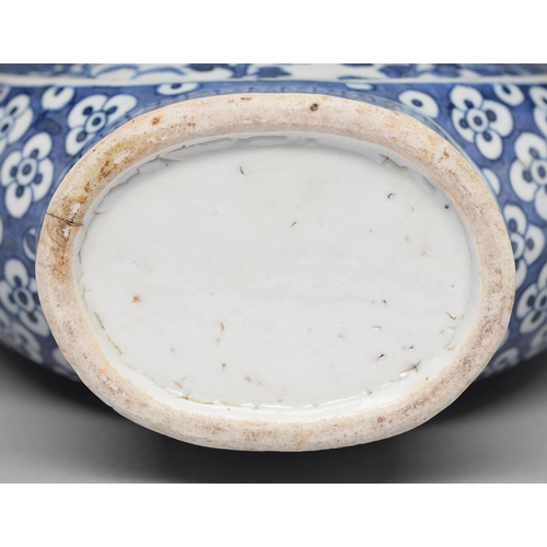 99 - A Chinese blue and white moon flask, 19th c, painted to either side with dragons and peony reserved ... 