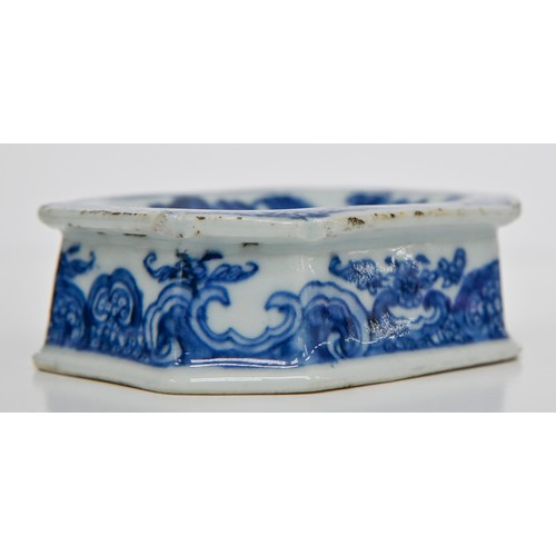 77 - A Chinese blue and white salt cellar, late 18th c, painted with peonies, tree and fence in panelled ... 