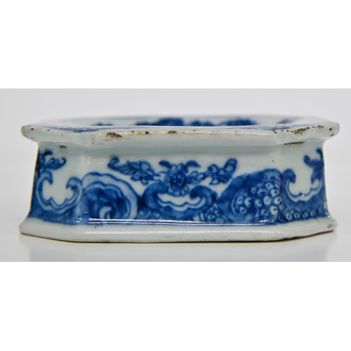 77 - A Chinese blue and white salt cellar, late 18th c, painted with peonies, tree and fence in panelled ... 