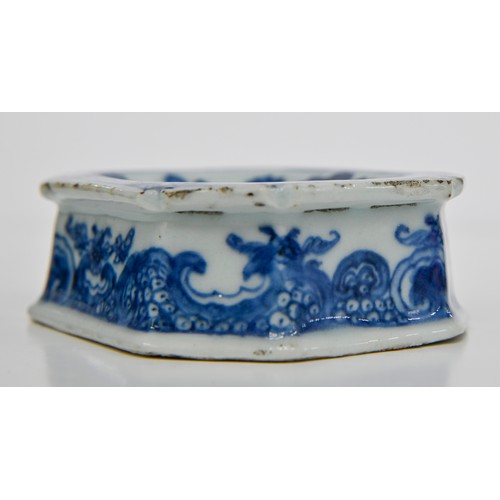 77 - A Chinese blue and white salt cellar, late 18th c, painted with peonies, tree and fence in panelled ... 