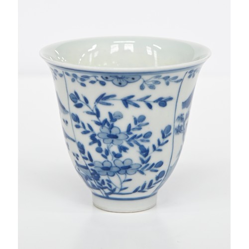 116 - A Chinese blue and white octagonal beaker, Kangxi period, painted in upright registers with flowerin... 