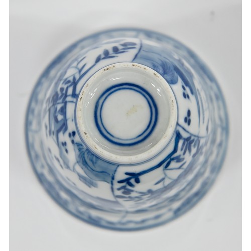 116 - A Chinese blue and white octagonal beaker, Kangxi period, painted in upright registers with flowerin... 