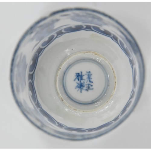 116 - A Chinese blue and white octagonal beaker, Kangxi period, painted in upright registers with flowerin... 