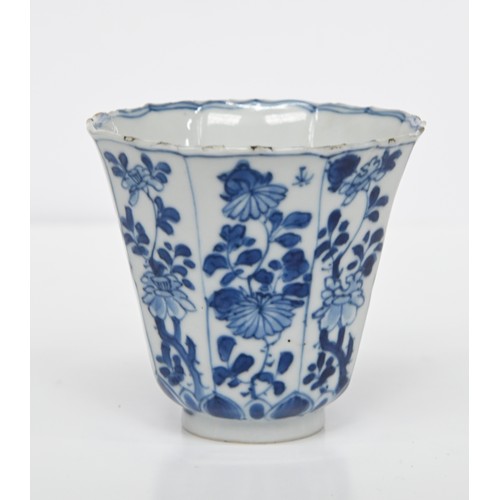 116 - A Chinese blue and white octagonal beaker, Kangxi period, painted in upright registers with flowerin... 