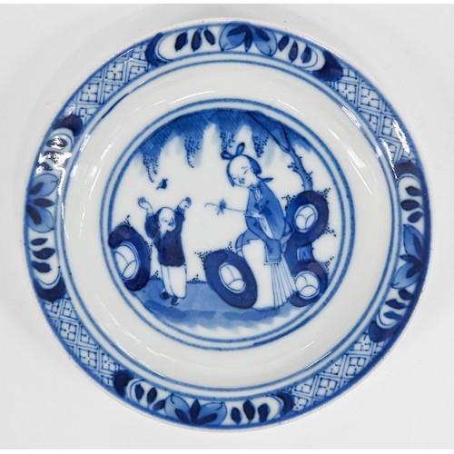 120 - A set of five Chinese blue and white miniature plates, 19th c, painted with a woman and child beneat... 