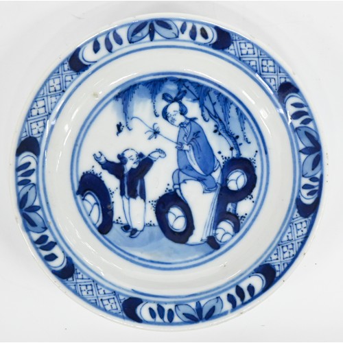 120 - A set of five Chinese blue and white miniature plates, 19th c, painted with a woman and child beneat... 