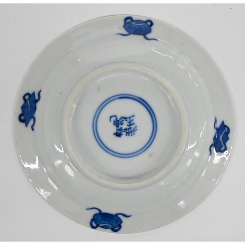 120 - A set of five Chinese blue and white miniature plates, 19th c, painted with a woman and child beneat... 