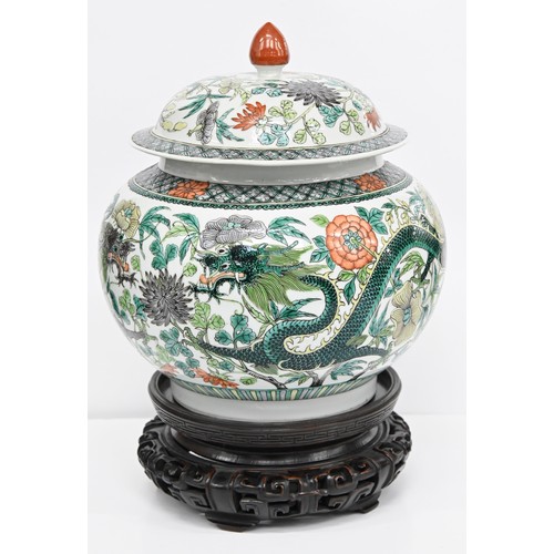 165 - A Chinese famille verte jar and cover, 19th / 20th c, enamelled with dragons and flowers in diaper b... 