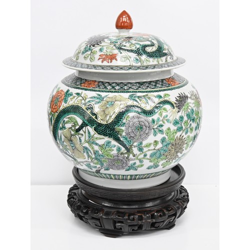 165 - A Chinese famille verte jar and cover, 19th / 20th c, enamelled with dragons and flowers in diaper b... 