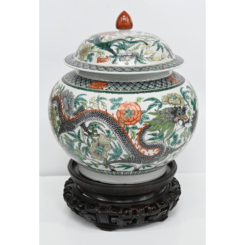 165 - A Chinese famille verte jar and cover, 19th / 20th c, enamelled with dragons and flowers in diaper b... 