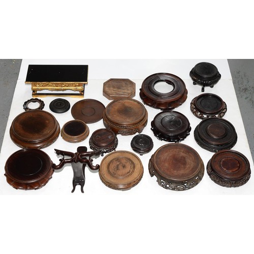 175 - Twenty Chinese and South East Asian wood stands, early 20th c and later, various sizes... 