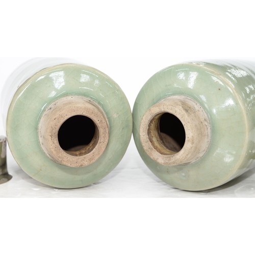 196 - Two Chinese celadon tea caddies, 19th c, the neck unglazed, associated silver coloured metal covers,... 