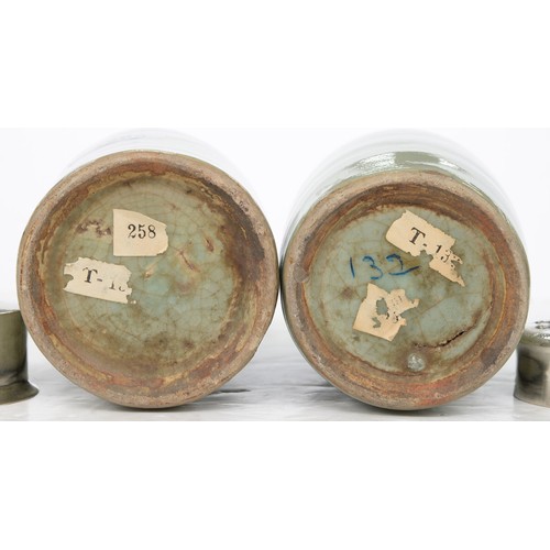 196 - Two Chinese celadon tea caddies, 19th c, the neck unglazed, associated silver coloured metal covers,... 