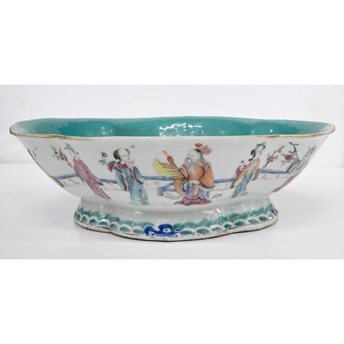 211 - A Chinese famille rose bowl, 19th c, enamelled with twelve individual figures in a continuous landsc... 