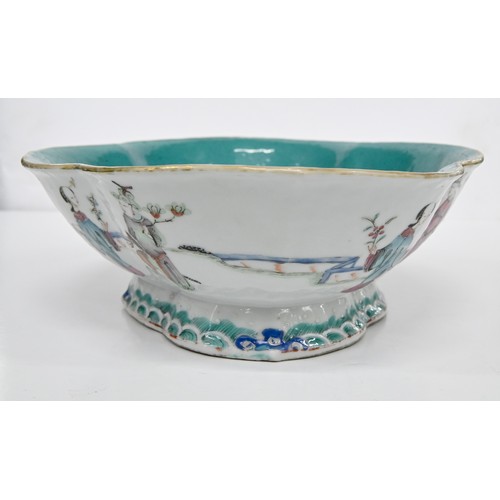 211 - A Chinese famille rose bowl, 19th c, enamelled with twelve individual figures in a continuous landsc... 