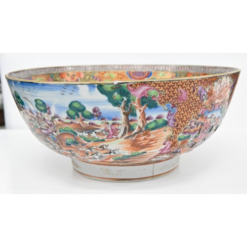 232 - A Chinese European-subject famille rose punch bowl, c1770, enamelled with hunting scenes and subsidi... 