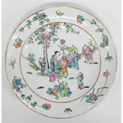 242 - Two Chinese famille rose plates, late 19th c, painted with a lady at a table attended by seven young... 