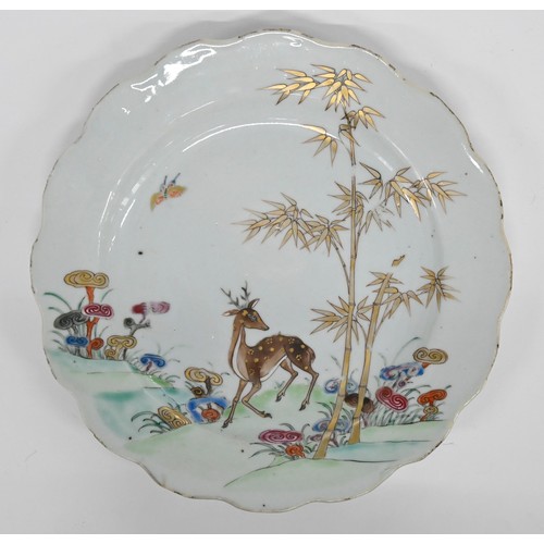 243 - A pair of Chinese famille rose plates, 18th c, enamelled with deer, bamboo and sacred fungus, 23cm d... 