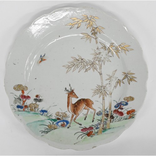 243 - A pair of Chinese famille rose plates, 18th c, enamelled with deer, bamboo and sacred fungus, 23cm d... 