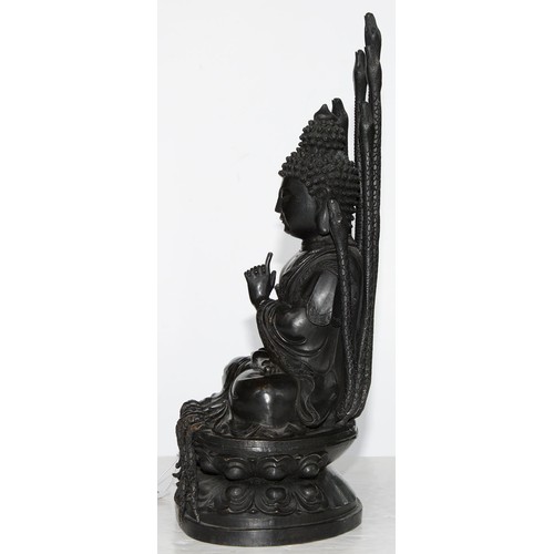 323 - A Tibetan bronze figure of Buddha Nagaraja, 18th c, seated in dhyanasana, the hands clasped in Uttar... 