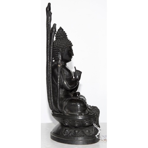 323 - A Tibetan bronze figure of Buddha Nagaraja, 18th c, seated in dhyanasana, the hands clasped in Uttar... 