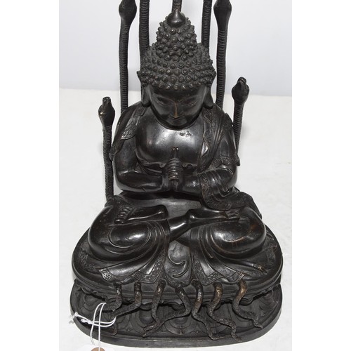 323 - A Tibetan bronze figure of Buddha Nagaraja, 18th c, seated in dhyanasana, the hands clasped in Uttar... 