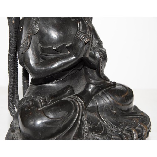 323 - A Tibetan bronze figure of Buddha Nagaraja, 18th c, seated in dhyanasana, the hands clasped in Uttar... 