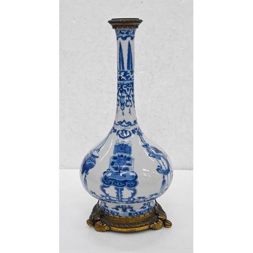2 - A pair of Chinese blue and white bottle vases, Kangxi period, on flared foot, painted to the central... 