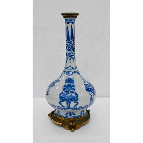2 - A pair of Chinese blue and white bottle vases, Kangxi period, on flared foot, painted to the central... 