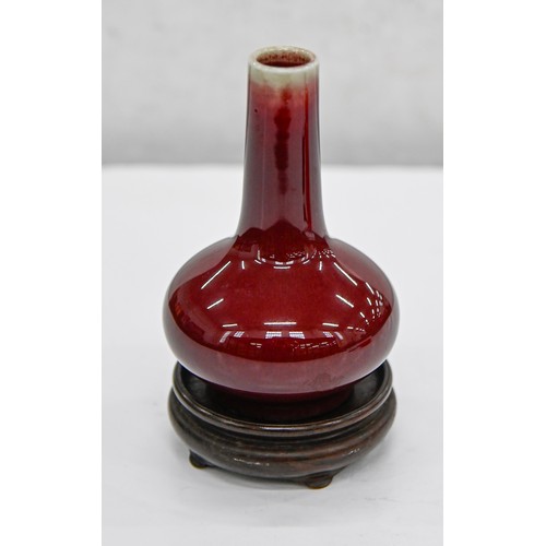 193 - A Chinese flambe glazed vase, 20th c, bottle shaped, the glaze thinning from the neck, 11.5cm h... 