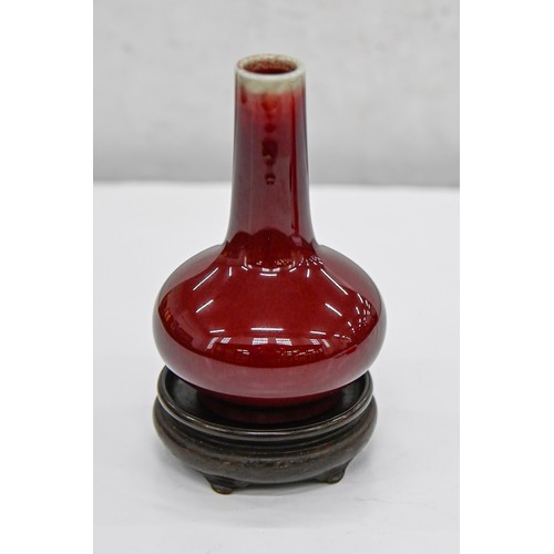 193 - A Chinese flambe glazed vase, 20th c, bottle shaped, the glaze thinning from the neck, 11.5cm h... 