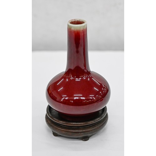 193 - A Chinese flambe glazed vase, 20th c, bottle shaped, the glaze thinning from the neck, 11.5cm h... 