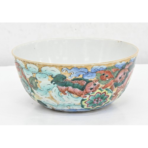 217 - A Chinese porcelain bowl, late 19th c, richly enamelled and gilt with dogs of Fo, a pomegranate to t... 