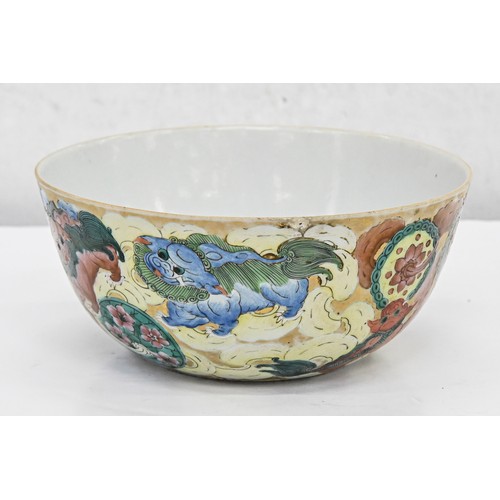 217 - A Chinese porcelain bowl, late 19th c, richly enamelled and gilt with dogs of Fo, a pomegranate to t... 